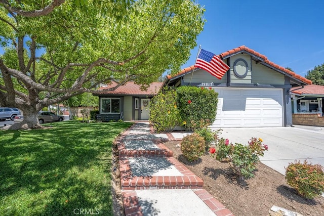 27817 Wakefield Rd, Castaic, CA 91384 - view of front of property featuring a tiled roof, a front lawn, an attached garage, and driveway