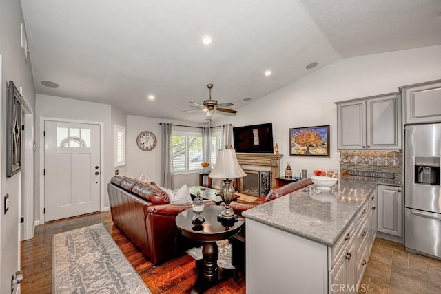 27817 Wakefield Rd, Castaic, CA 91384 - living room featuring lofted ceiling, a ceiling fan, recessed lighting, and a fireplace