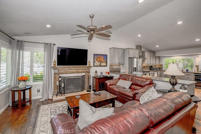 27817 Wakefield Rd, Castaic, CA 91384 - living area with lofted ceiling, a ceiling fan, a fireplace, wood-type flooring, and recessed lighting