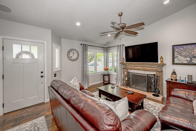 27817 Wakefield Rd, Castaic, CA 91384 - living room featuring lofted ceiling, a ceiling fan, a fireplace with raised hearth, recessed lighting, and wood finished floors