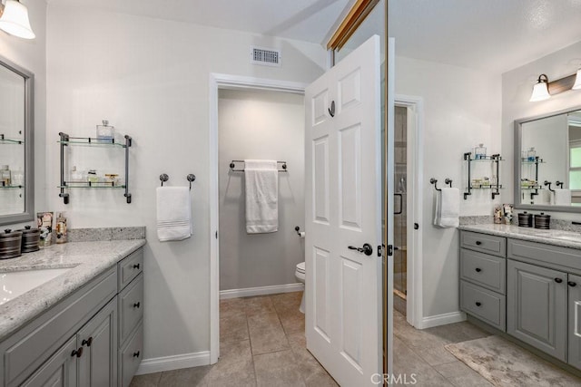 27817 Wakefield Rd, Castaic, CA 91384 - full bath featuring two vanities, tile patterned floors, and a shower