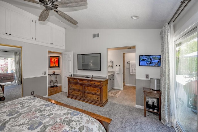 27817 Wakefield Rd, Castaic, CA 91384 - bedroom featuring lofted ceiling, light colored carpet, a textured ceiling, a ceiling fan, and ensuite bathroom
