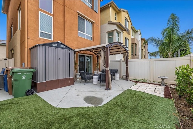 12039 Stanley Park Ct, Hawthorne, CA 90250 - rear view of property featuring a shed, a pergola, a fenced backyard, a patio area, and stucco siding