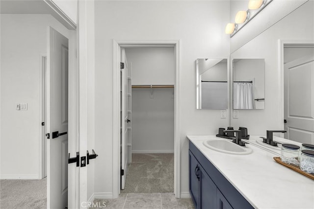 12039 Stanley Park Ct, Hawthorne, CA 90250 - bathroom featuring vanity and a walk in closet