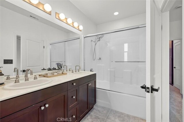 12039 Stanley Park Ct, Hawthorne, CA 90250 - bathroom featuring double vanity, combined bath / shower with glass door, and tile patterned flooring