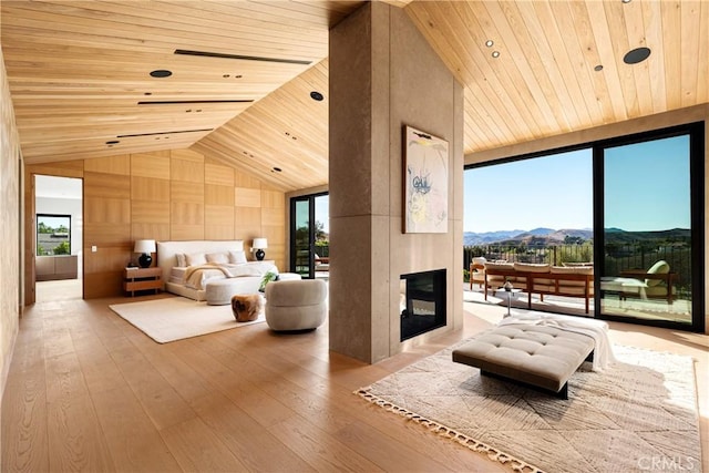 25151 Jim Bridger Rd, Hidden Hills, CA 91302 - bedroom featuring wooden ceiling, access to outside, a mountain view, lofted ceiling, and hardwood / wood-style floors