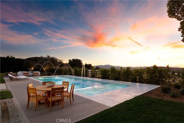 25151 Jim Bridger Rd, Hidden Hills, CA 91302 - outdoor pool with outdoor dining area, a patio area, and an outdoor living space