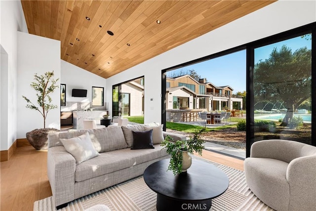 25151 Jim Bridger Rd, Hidden Hills, CA 91302 - living room with vaulted ceiling, wood ceiling, and wood finished floors