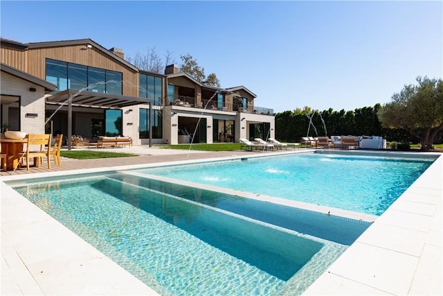 25151 Jim Bridger Rd, Hidden Hills, CA 91302 - swimming pool featuring a patio and an outdoor living space