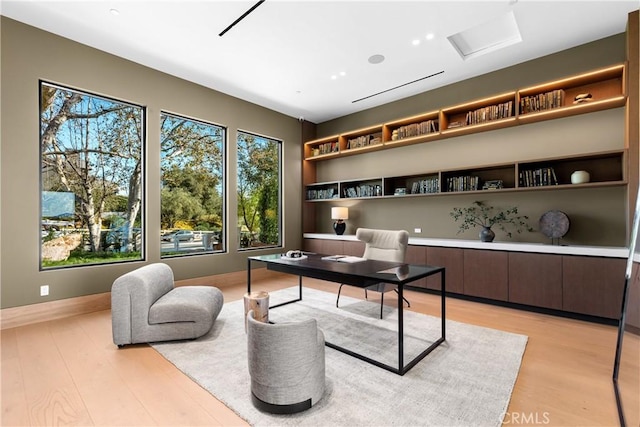 25151 Jim Bridger Rd, Hidden Hills, CA 91302 - office area with built in features and light wood-style floors