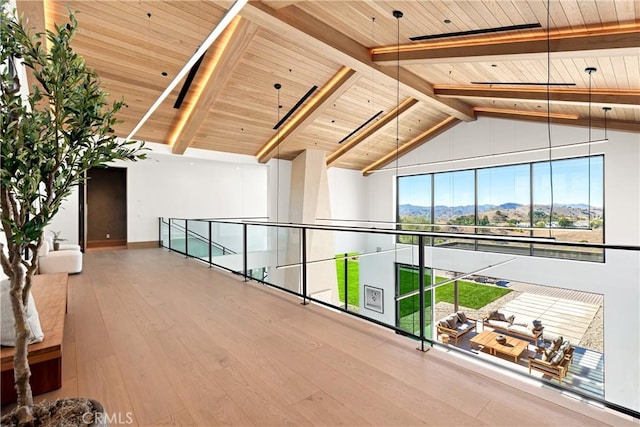 25151 Jim Bridger Rd, Hidden Hills, CA 91302 - hall with a wooden ceiling with exposed beams, a mountain view, wood finished floors, and high vaulted ceiling