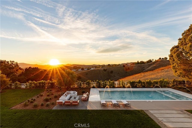 25151 Jim Bridger Rd, Hidden Hills, CA 91302 - swimming pool with a yard, an outdoor living space, a patio, and a mountain view