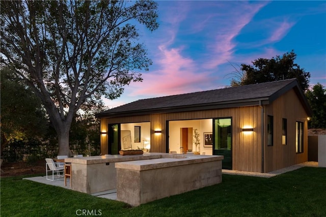 25151 Jim Bridger Rd, Hidden Hills, CA 91302 - rear view of house featuring a lawn and a patio area