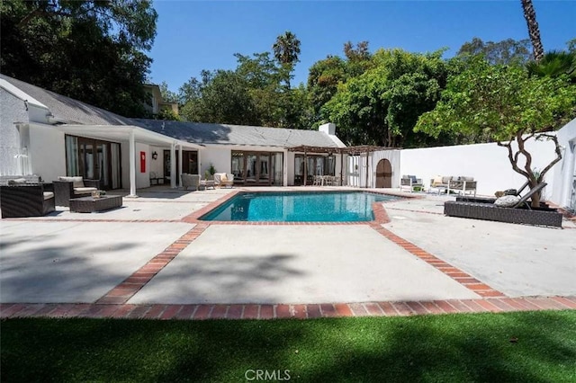 3183 N Laurel Canyon Blvd, Studio City, CA 91604 - view of swimming pool featuring an outdoor living space, a patio, a fenced backyard, and french doors