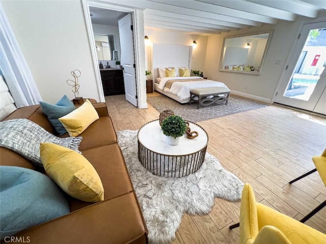 3183 N Laurel Canyon Blvd, Studio City, CA 91604 - bedroom with beamed ceiling, access to exterior, wood finished floors, and connected bathroom