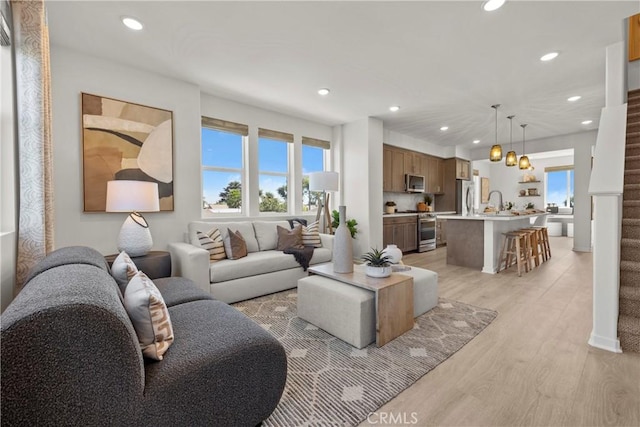 7348 Foster Bridge Blvd, Downey, CA 90240 - living room featuring recessed lighting and light wood finished floors