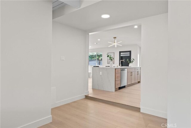 12934 Fenton Ave, Sylmar, CA 91342 - kitchen featuring stainless steel dishwasher, light countertops, light wood-style floors, recessed lighting, and modern cabinets