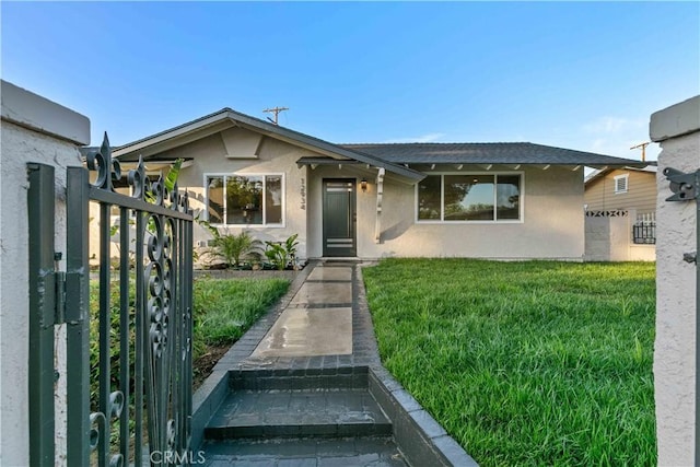 12934 Fenton Ave, Sylmar, CA 91342 - view of front of home featuring stucco siding and a front lawn