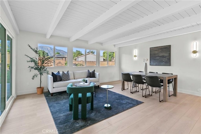 12934 Fenton Ave, Sylmar, CA 91342 - living area with light wood finished floors, healthy amount of natural light, and beam ceiling