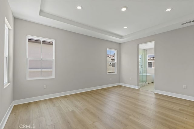 573 Patten Ave, Placentia, CA 92870 - spare room featuring light wood finished floors, a raised ceiling, and recessed lighting