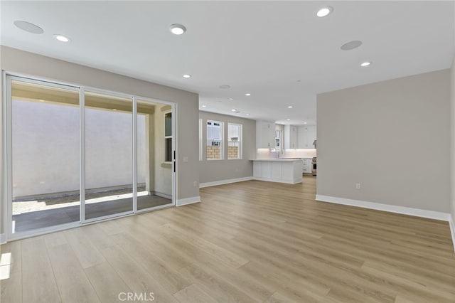 573 Patten Ave, Placentia, CA 92870 - unfurnished living room featuring light wood-type flooring and recessed lighting