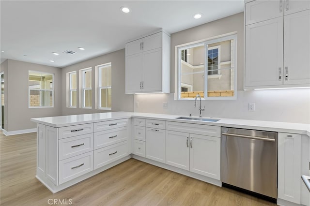 573 Patten Ave, Placentia, CA 92870 - kitchen featuring stainless steel dishwasher, a peninsula, light countertops, white cabinetry, and recessed lighting
