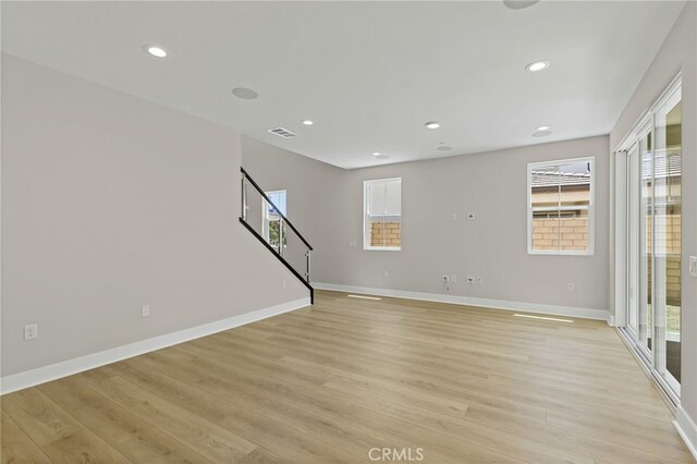 573 Patten Ave, Placentia, CA 92870 - spare room featuring light wood finished floors, plenty of natural light, recessed lighting, and stairs
