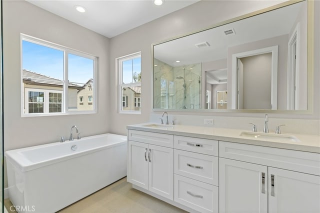 573 Patten Ave, Placentia, CA 92870 - bathroom featuring a marble finish shower, double vanity, a freestanding bath, and recessed lighting