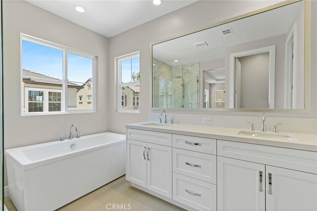 573 Patten Ave, Placentia, CA 92870 - full bath featuring a marble finish shower, double vanity, a soaking tub, and recessed lighting