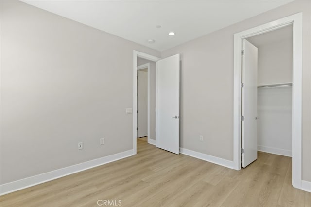 573 Patten Ave, Placentia, CA 92870 - unfurnished bedroom featuring light wood finished floors, a spacious closet, recessed lighting, and a closet