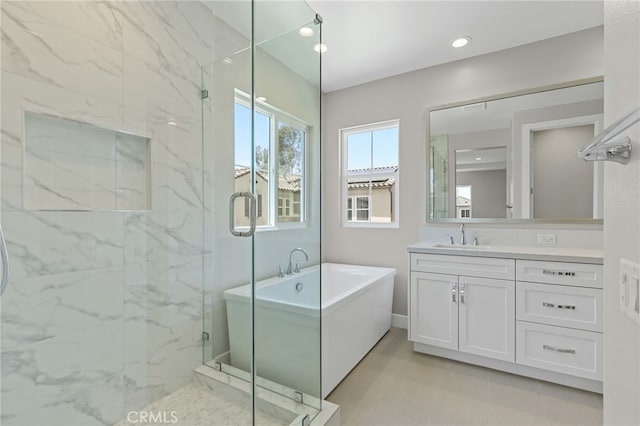 573 Patten Ave, Placentia, CA 92870 - bathroom with vanity, a marble finish shower, a freestanding tub, and recessed lighting