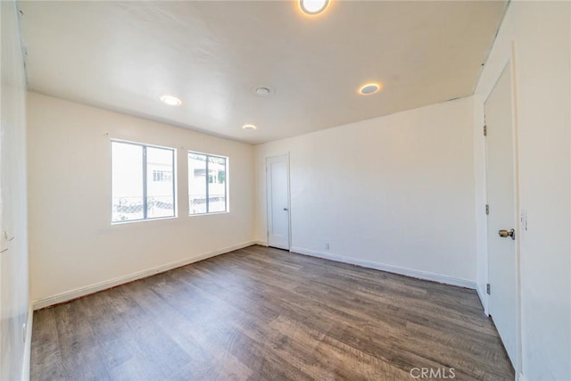 1455 S Towne Ave, Pomona, CA 91766 - empty room with wood finished floors and recessed lighting