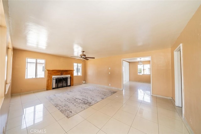 1455 S Towne Ave, Pomona, CA 91766 - unfurnished living room featuring plenty of natural light, a ceiling fan, and light tile patterned floors