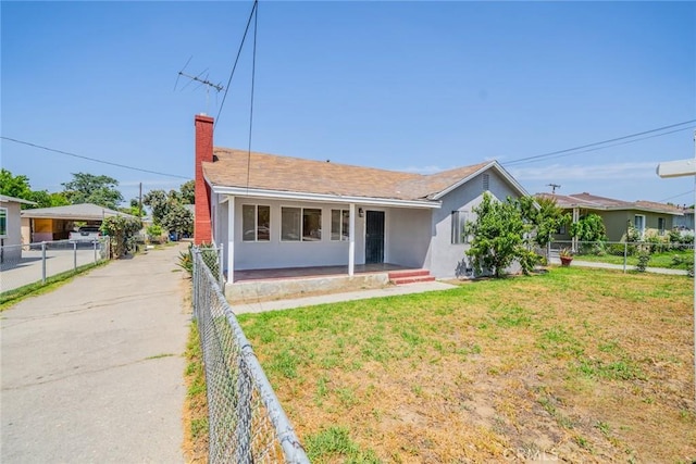 1455 S Towne Ave, Pomona, CA 91766 - ranch-style home featuring a chimney, stucco siding, and a fenced backyard