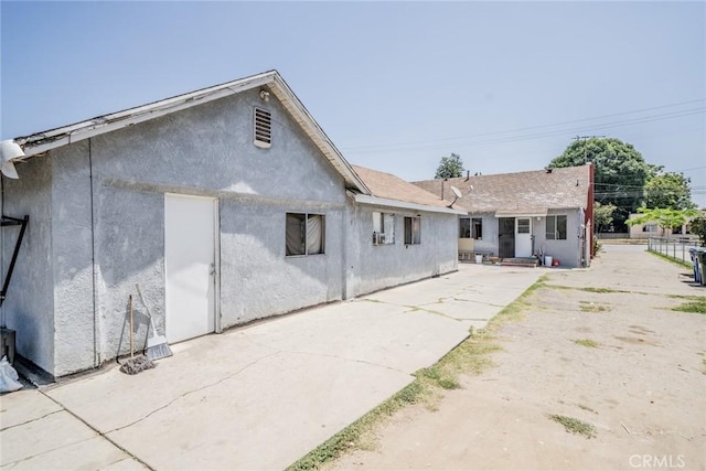 1455 S Towne Ave, Pomona, CA 91766 - back of house featuring a patio and stucco siding
