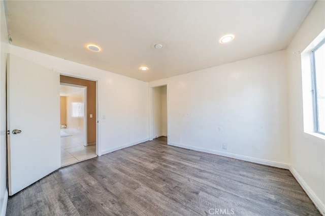 1455 S Towne Ave, Pomona, CA 91766 - empty room with wood finished floors and recessed lighting