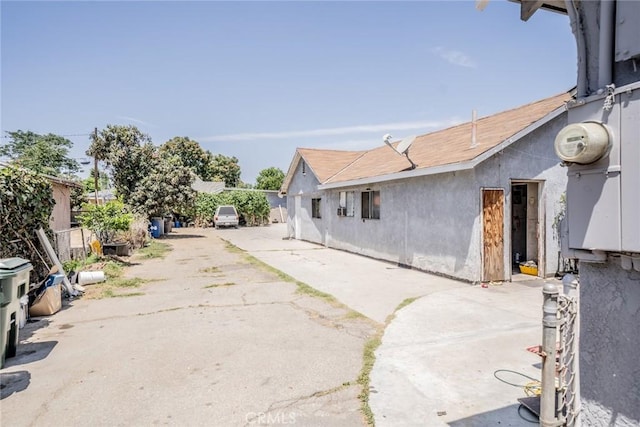 1455 S Towne Ave, Pomona, CA 91766 - rear view of house featuring a patio area and stucco siding