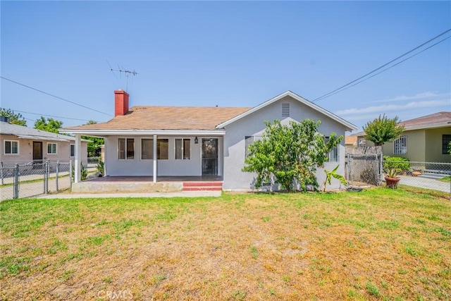 1455 S Towne Ave, Pomona, CA 91766 - back of house with a gate, a chimney, and stucco siding