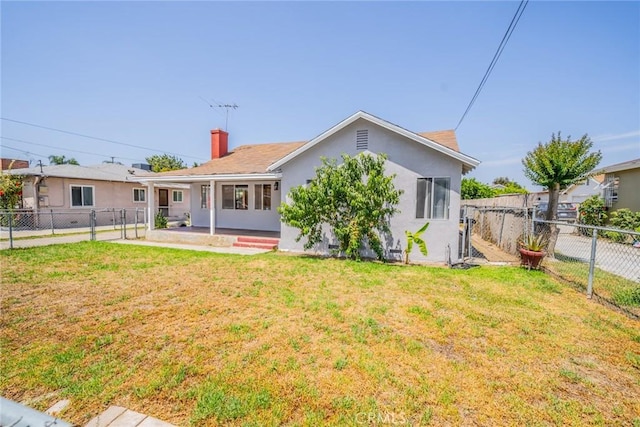 1455 S Towne Ave, Pomona, CA 91766 - back of house with a fenced backyard, stucco siding, a chimney, and a patio