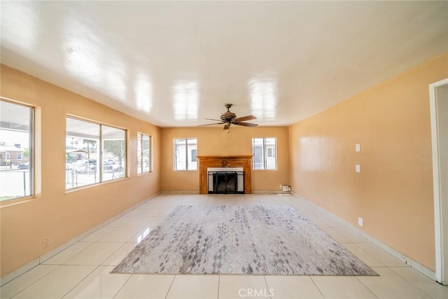 1455 S Towne Ave, Pomona, CA 91766 - unfurnished living room with ceiling fan, a fireplace, and light tile patterned floors