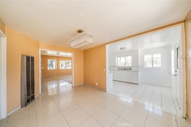 1455 S Towne Ave, Pomona, CA 91766 - spare room featuring a heating unit and light tile patterned flooring