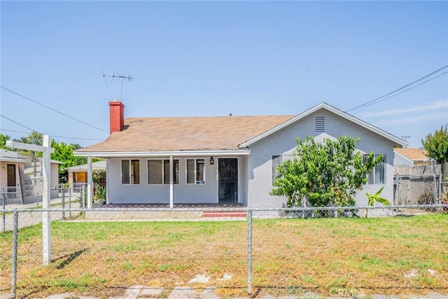 1455 S Towne Ave, Pomona, CA 91766 - back of property featuring stucco siding and a chimney