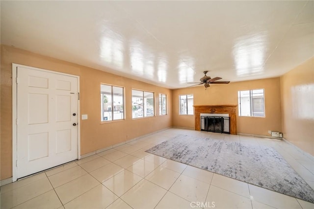 1455 S Towne Ave, Pomona, CA 91766 - unfurnished living room with a ceiling fan, a glass covered fireplace, and tile patterned flooring