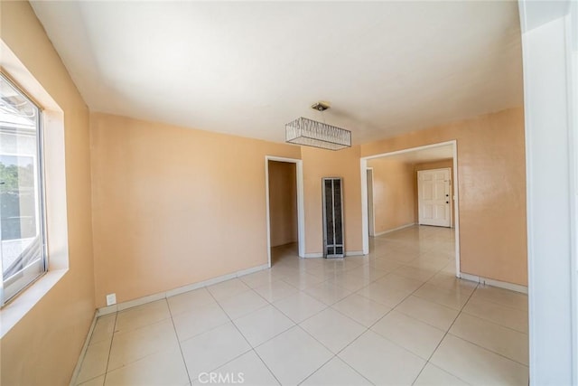 1455 S Towne Ave, Pomona, CA 91766 - empty room featuring a heating unit and light tile patterned flooring