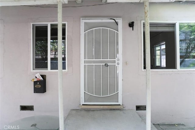 343 Concord St, Glendale, CA 91203 - doorway to property with stucco siding and crawl space