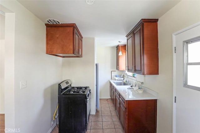 343 Concord St, Glendale, CA 91203 - kitchen with stainless steel range with gas cooktop, light countertops, and light tile patterned flooring