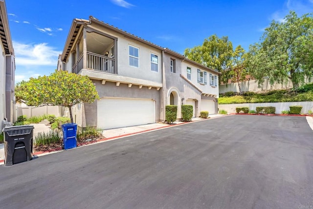 2755 Castlehill Rd Unit 1, Chula Vista, CA 91915 - townhome / multi-family property with an attached garage, stucco siding, and a balcony