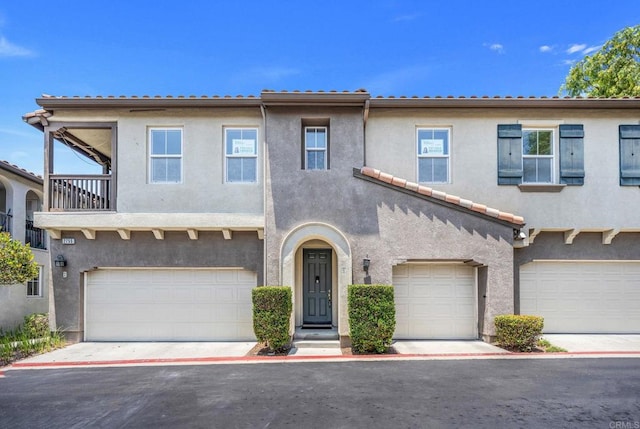2755 Castlehill Rd Unit 1, Chula Vista, CA 91915 - multi unit property featuring an attached garage, stucco siding, and a balcony