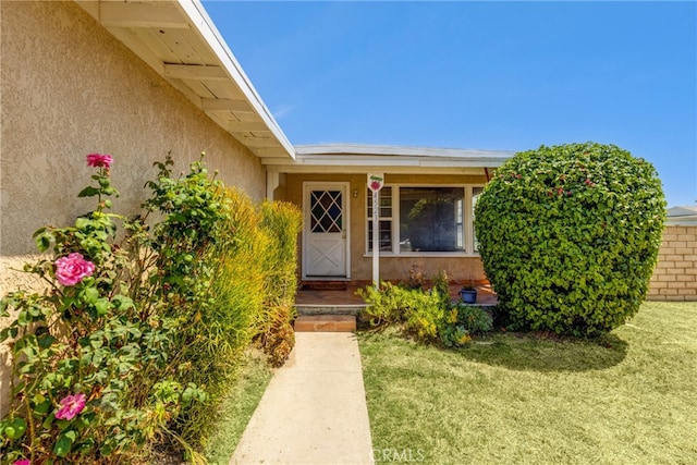 4523 Columbia Ave, Riverside, CA 92501 - entrance to property featuring stucco siding and a lawn