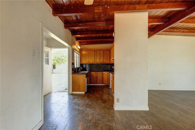 4523 Columbia Ave, Riverside, CA 92501 - kitchen with a wooden ceiling with exposed beams, dark wood-style floors, dark countertops, brown cabinets, and decorative backsplash